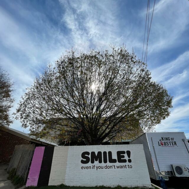 a sign on the side of the road