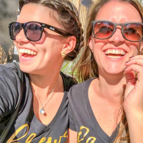 a couple of people that are wearing glasses and smiling at the camera