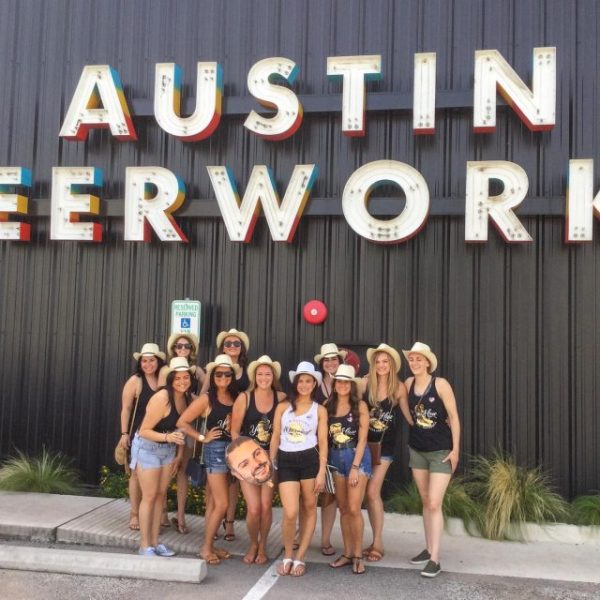 bachelorette group posing outside Austin Beerworks Brewing