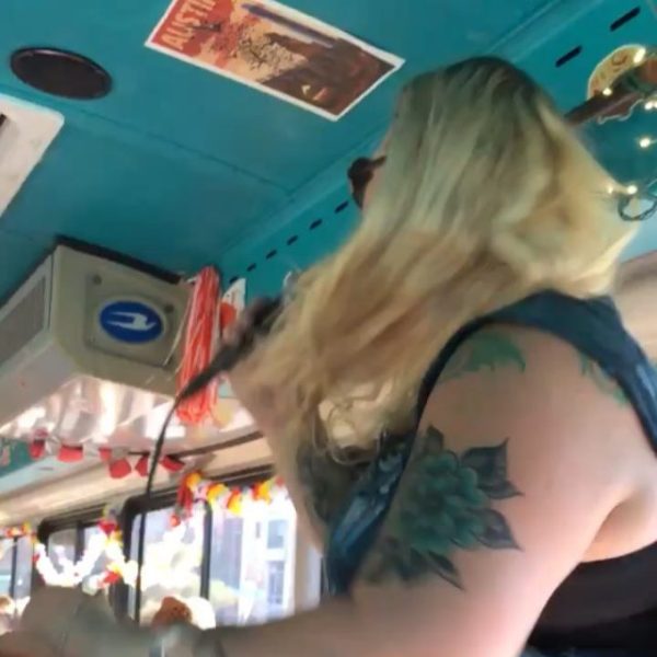 a woman singing into a microphone