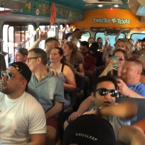 crowd of people singing along with band