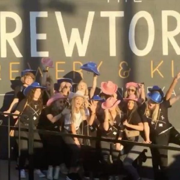 bachelorettes in silly poses in front of Brewtorium