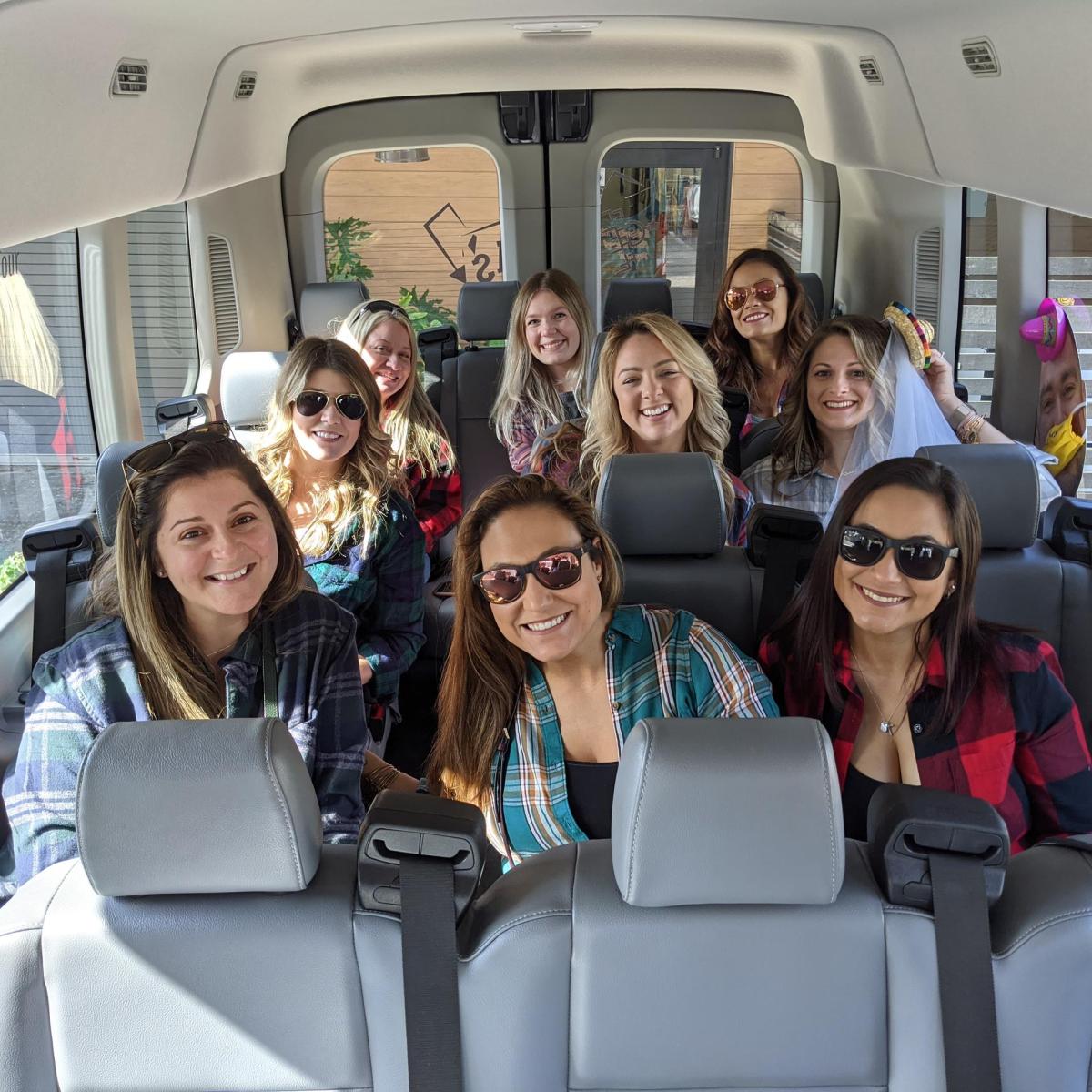 a group of people standing around a bus