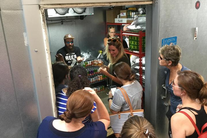 a group of people sitting in front of a building