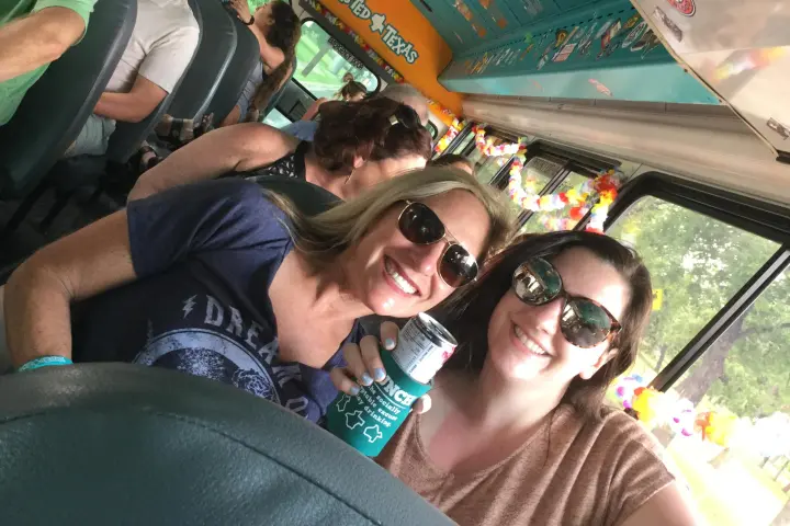 a group of people taking a selfie in a car