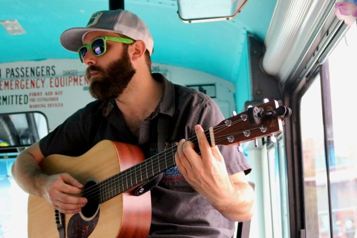 a man holding a guitar
