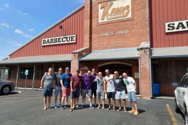 a group of people standing in front of a building