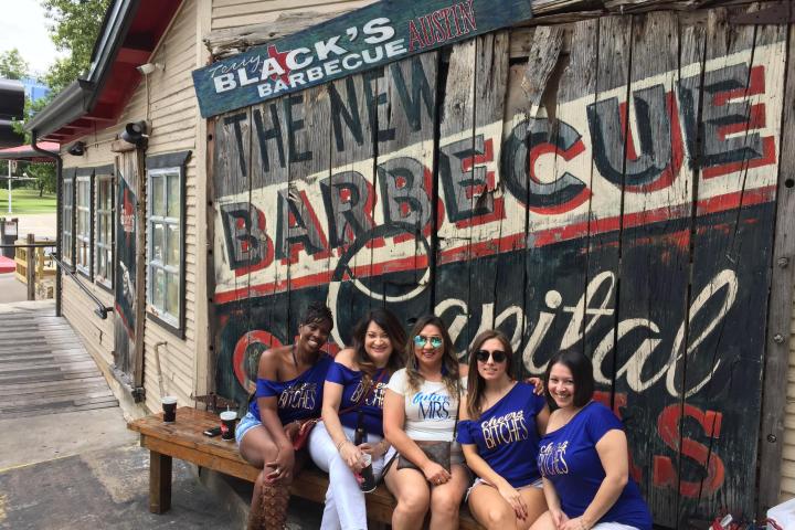 a group of people standing in front of a building