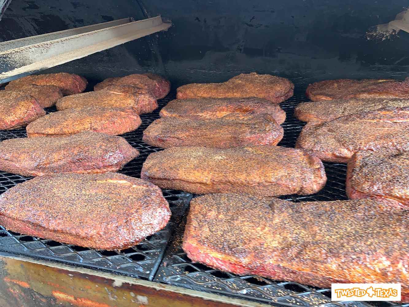 a tray of BBQ on a grill