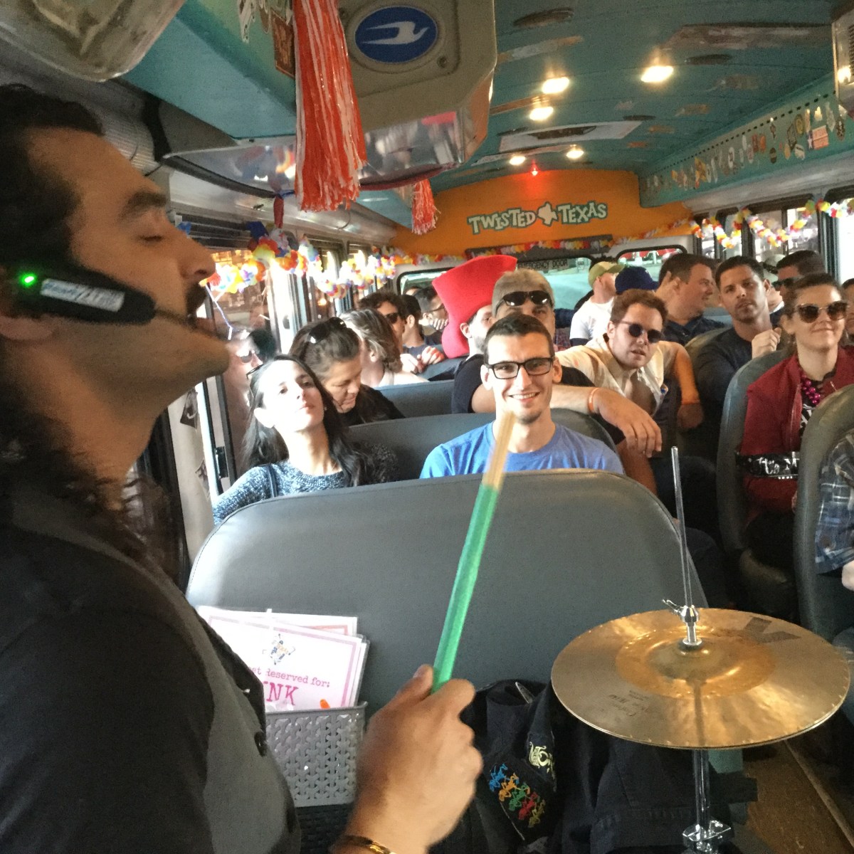 Drummer on headset performing on bus